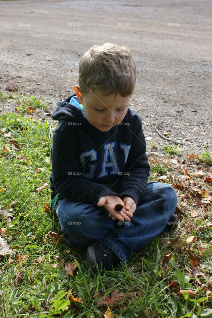Mason and his caterpillar . Day at the farm trying to find the perfect pumpkin