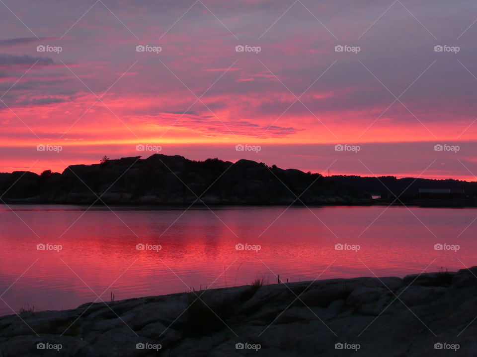 Scenic view of sea at sunset