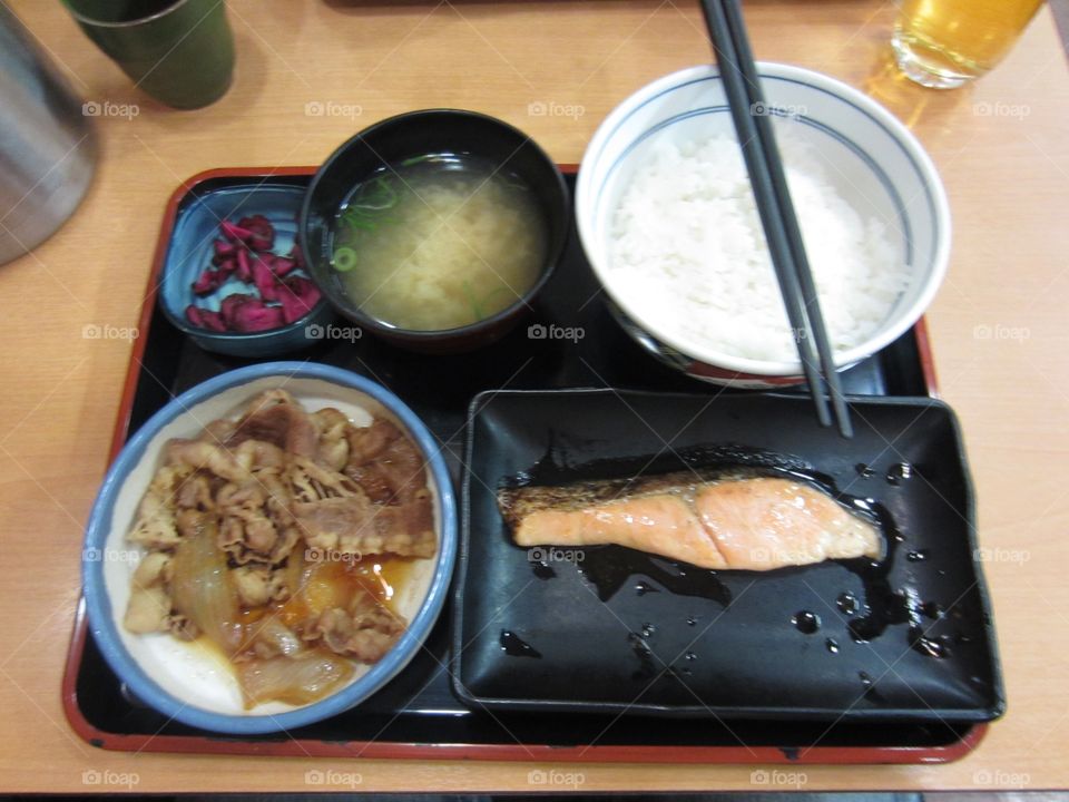 Traditional Japanese Bento Meal with Rice, Fish, Miso Soup and Pickled Vegetables