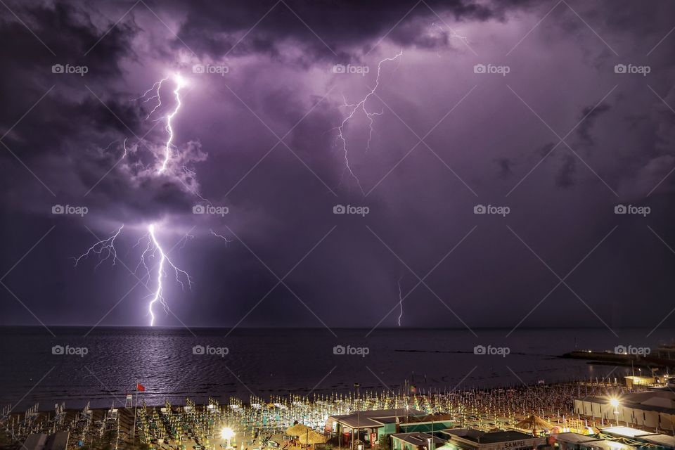 Thunderstorm and lightning over the sea at night