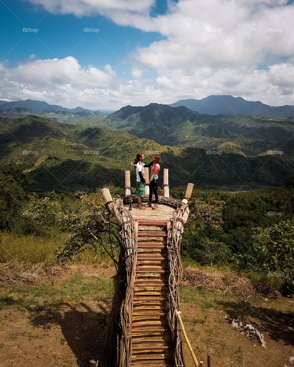 This photo was taken from one of the mountains in the Philippines. It's just a minor hike that even a beginner can do it. It took 6 hours to reach the peak and to see this view with a hand facing towards the mountains.