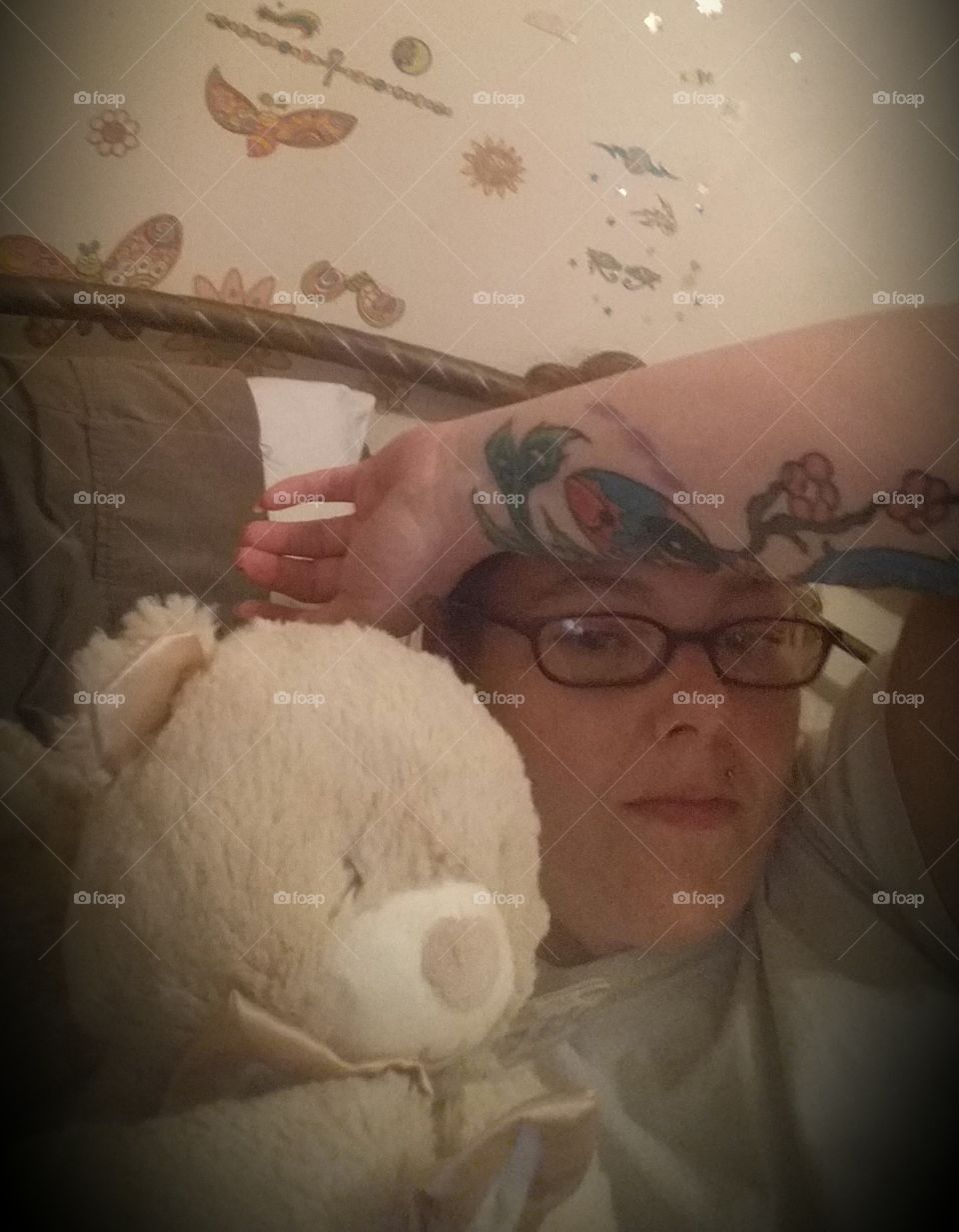 Young man sleeping with toy