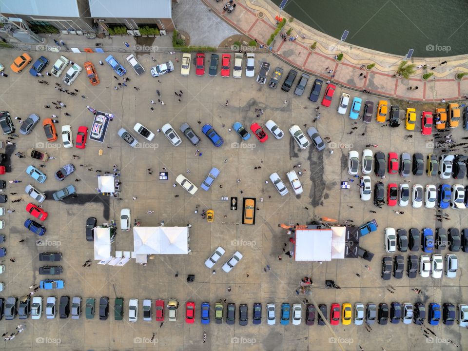 drone aerial view from above of cars parked