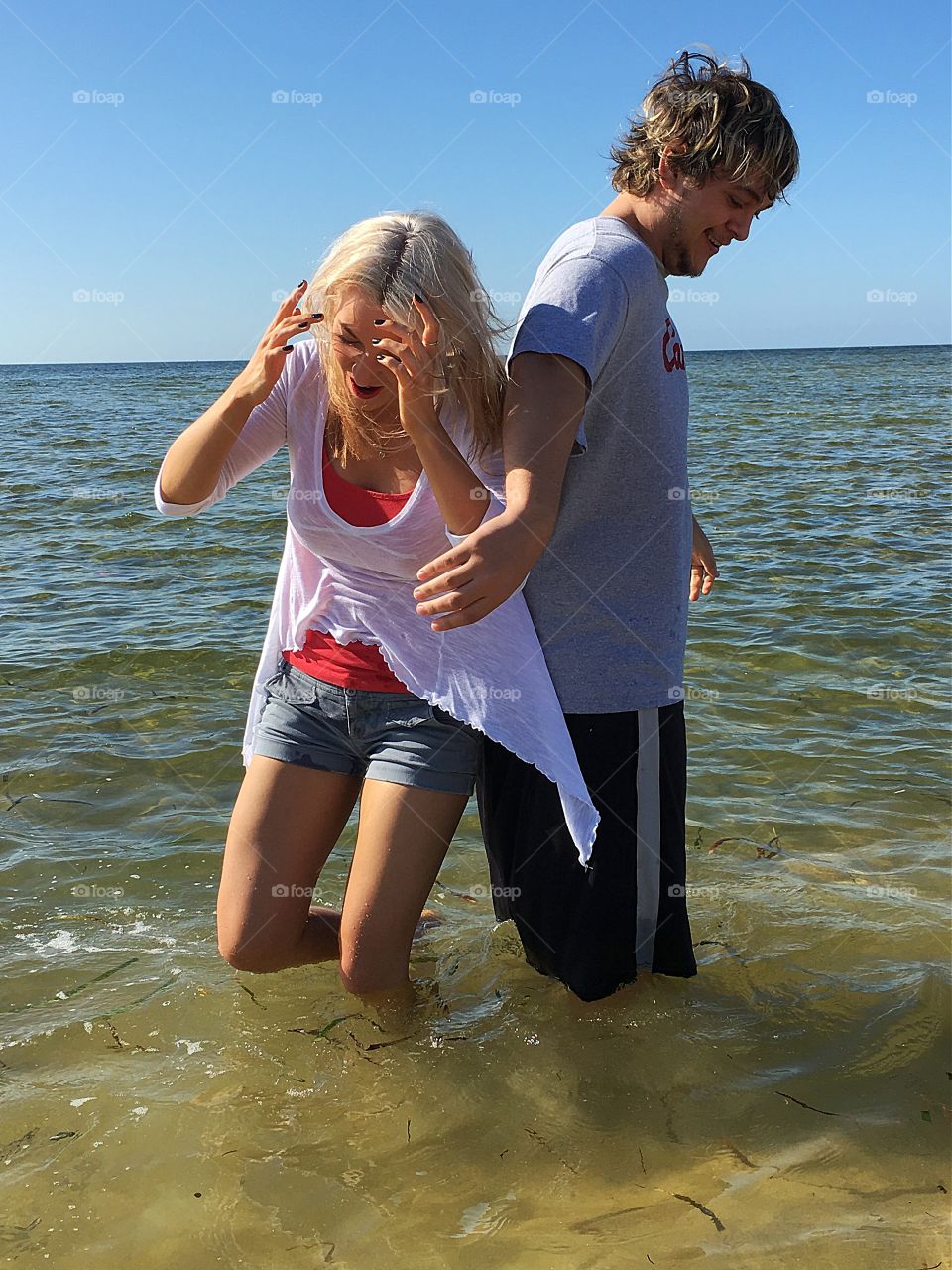 Young couple enjoying in the sea