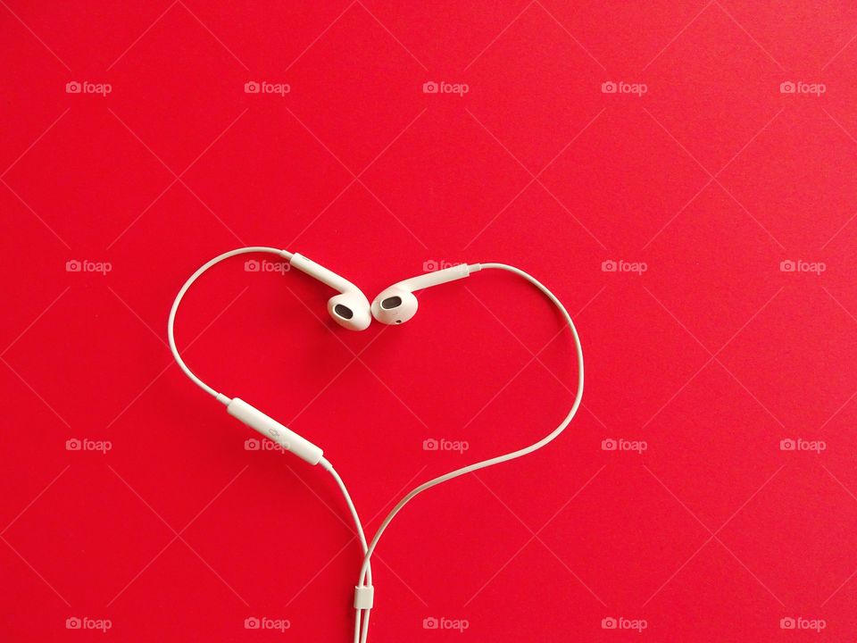 Earphone on a red background 