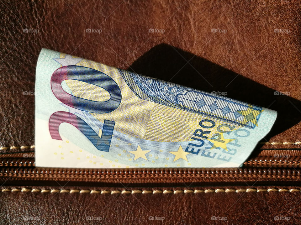 20 euro note in brown bag.