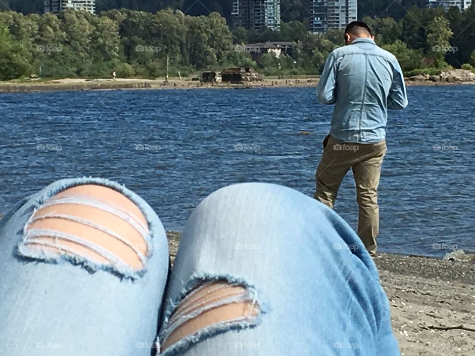 View of man on beach in Port Moody British Columbia 