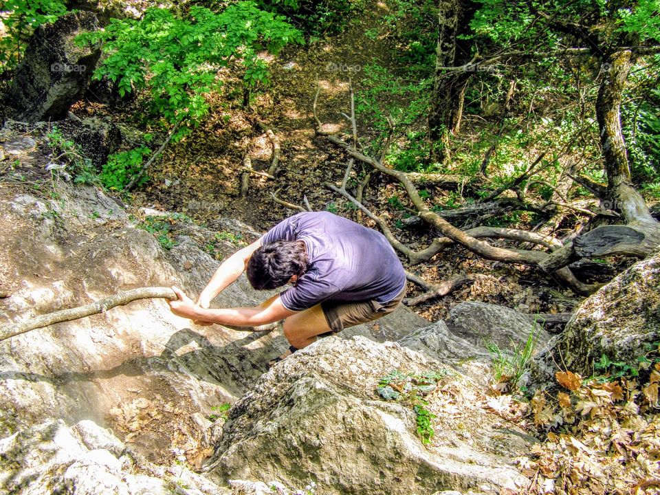 a man climbs a mountain