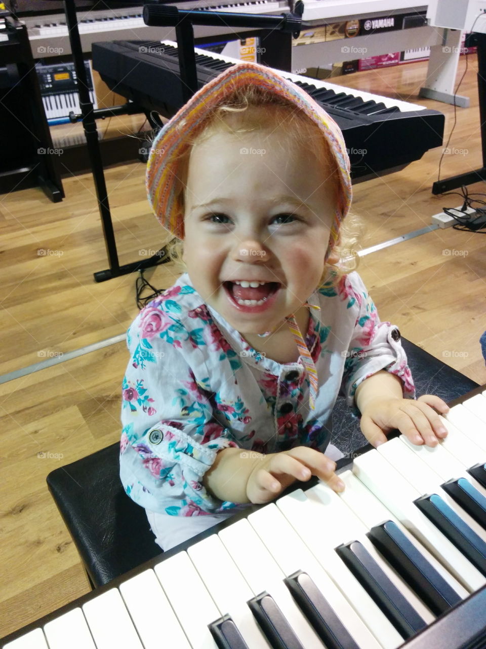 Happiness. little girl play the piano