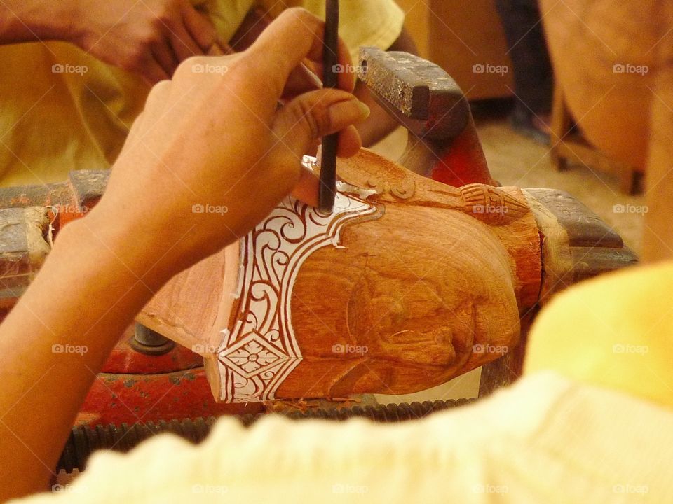 Artist working on sculpture