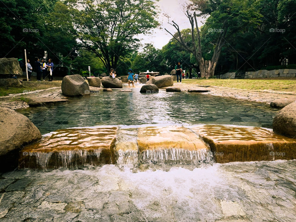 beautiful artificial waterfall in tourist park