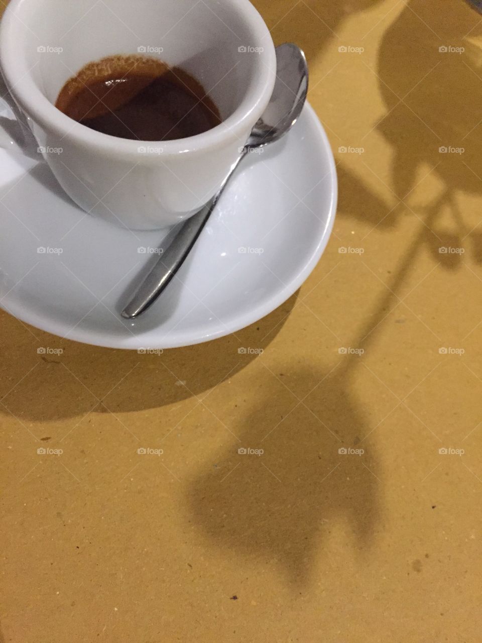 Coffee with flower shadow 