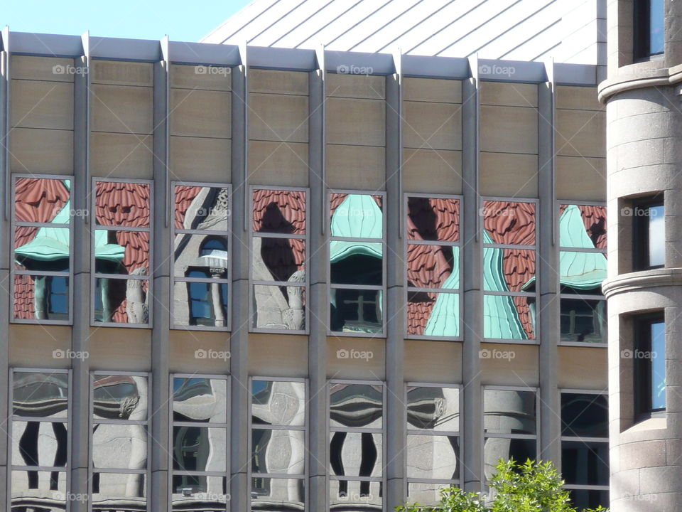 distorted window reflections on
 buildings