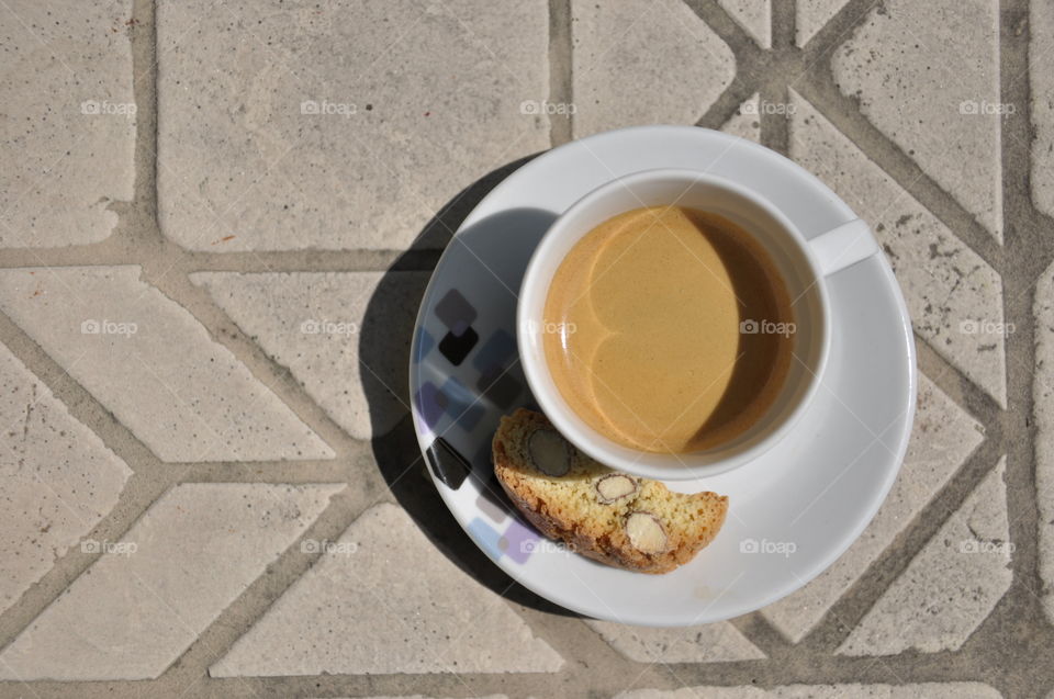 cup of espresso and a gantuccini cookie