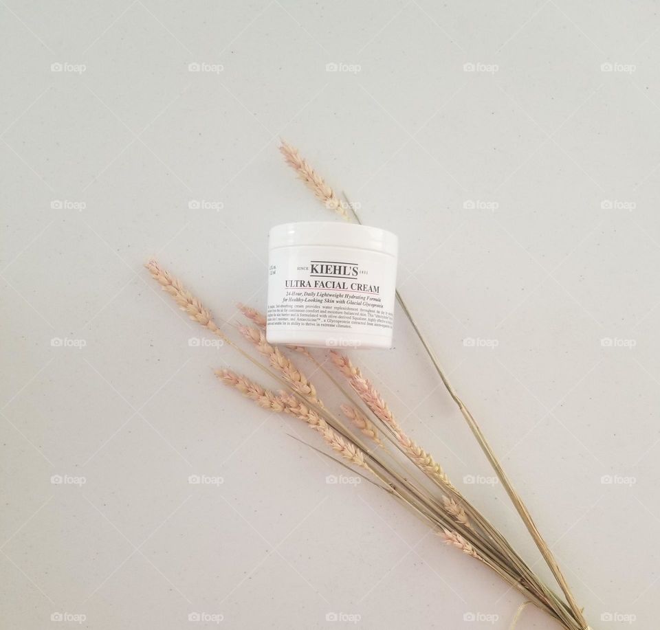 Minimalist flat lay with Kiehl's face cream.