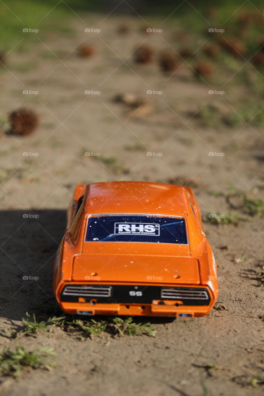 toy car on a dirt road in a park in downtown Sacramento California. toy, car, supercharged, Park