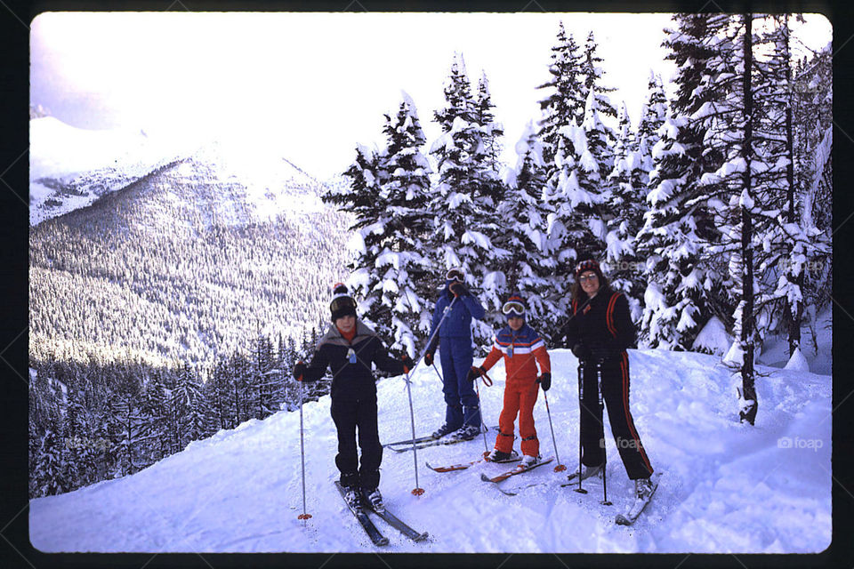 Family skiing top of the World