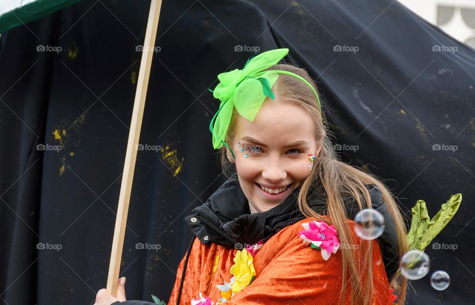 Portrait of happy girl dressed as fairy at carnival