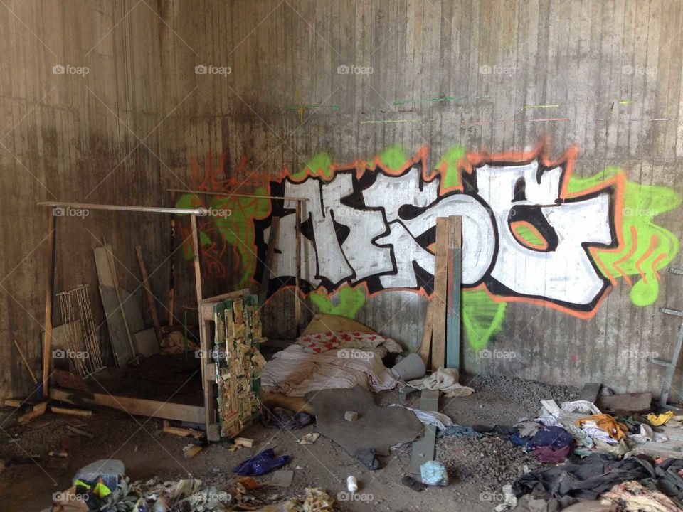 Makeshift shelter of a homeless person under a bridge in Stockholm, Sweden