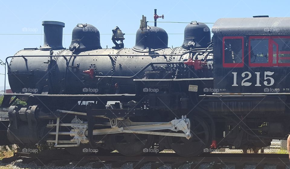 A retired steam engine restored and housed in a history park.