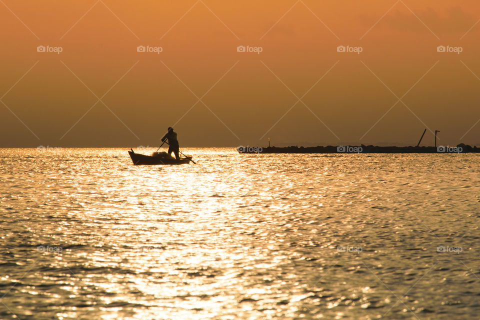 Fisherman and sunset