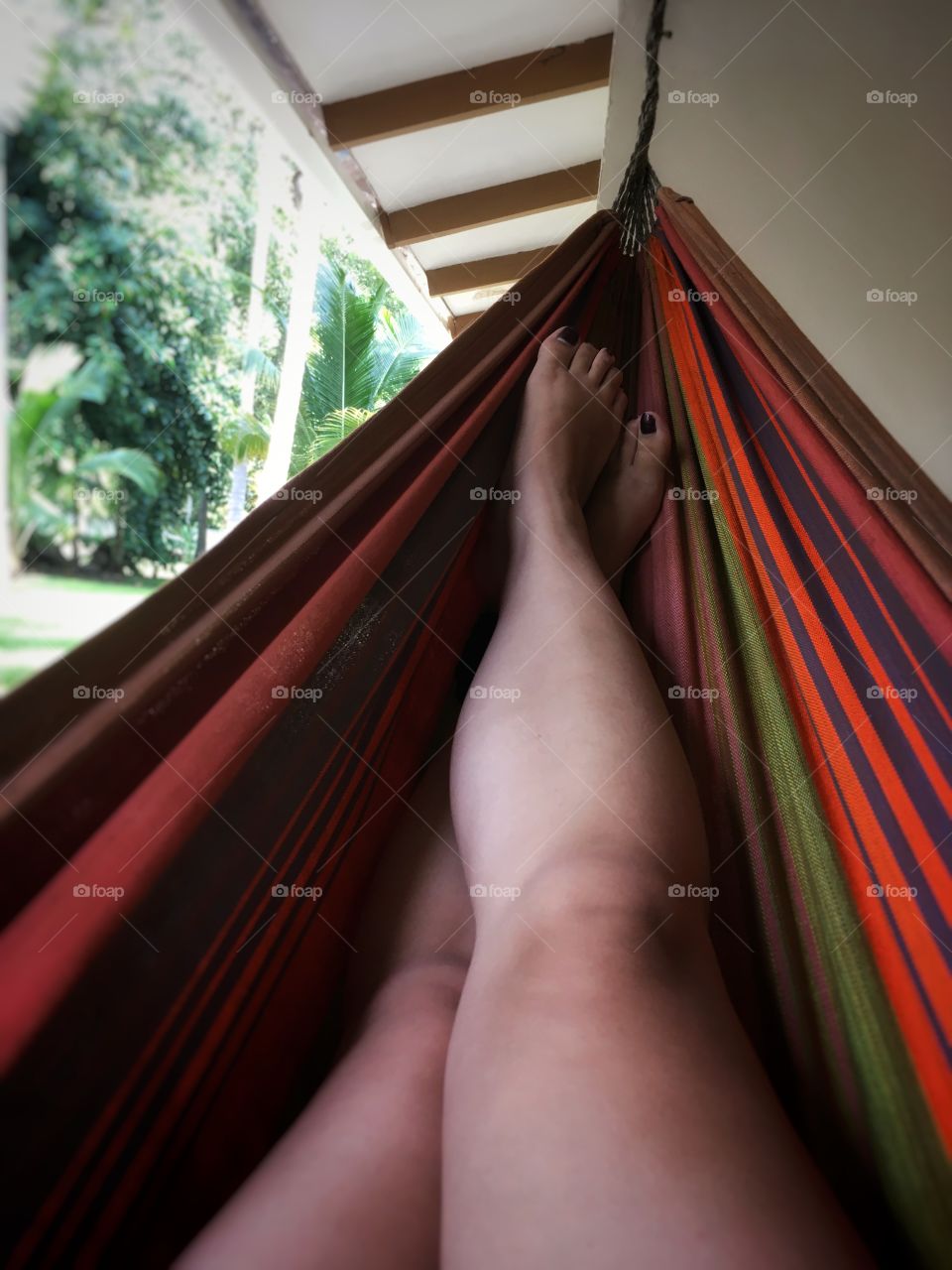 Relaxing on a colourful hammock