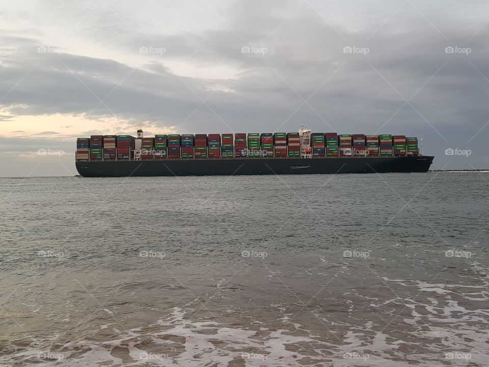 Company's container ship called; Evergreen. A container ship is a cargo ship, a means of transport for sea containers.