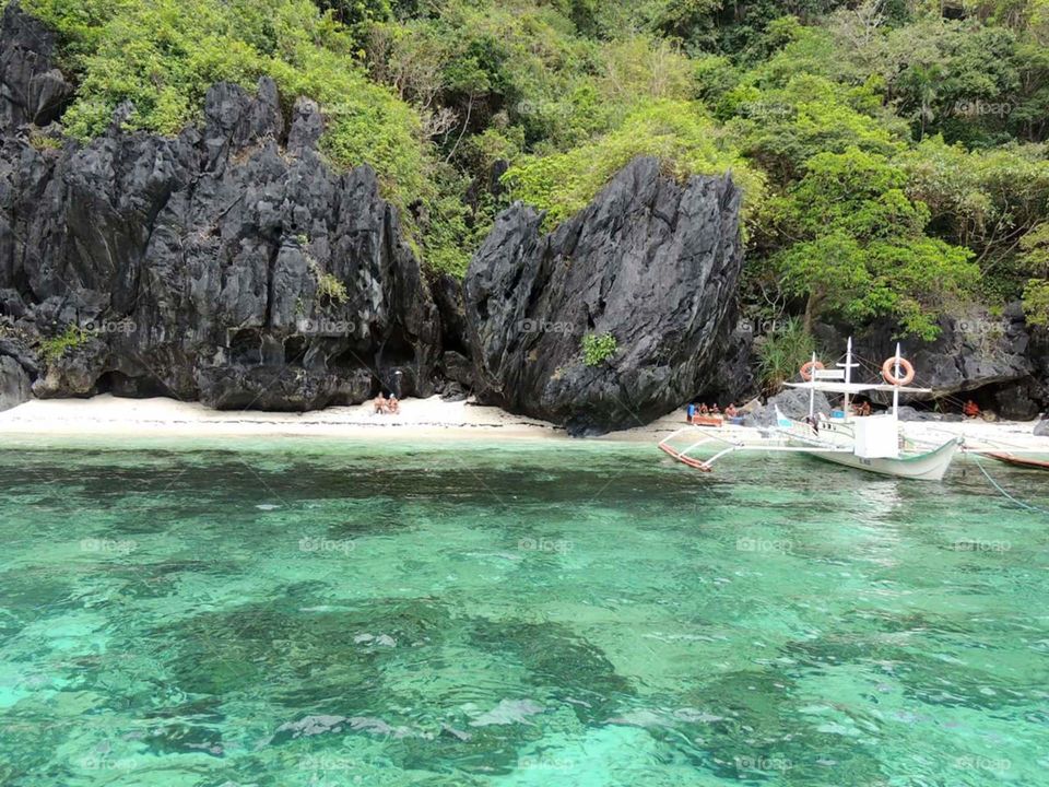El Nido's Entalula Island. nestled in the middle of stunning Bacuit Bay in El Nido, Palawan, PH with one of the 40 beaches around the area