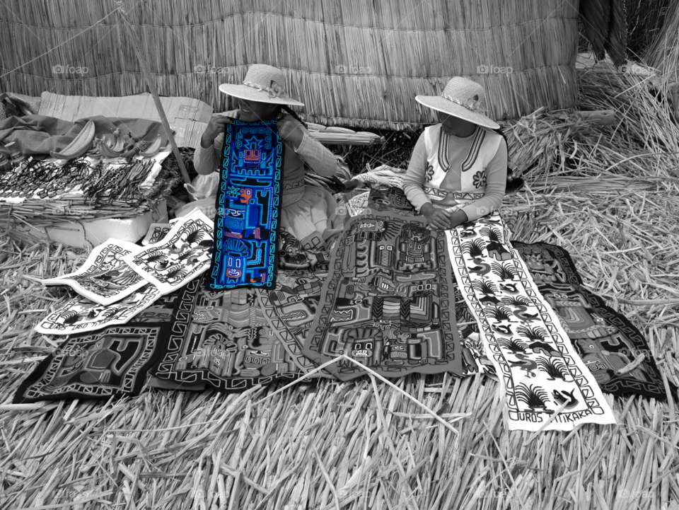 Peruvian women selling traditional handmade textiles