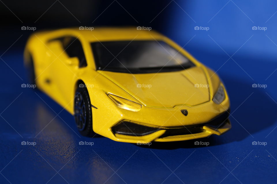 close-up of a Lamborghini burago yellow toy car