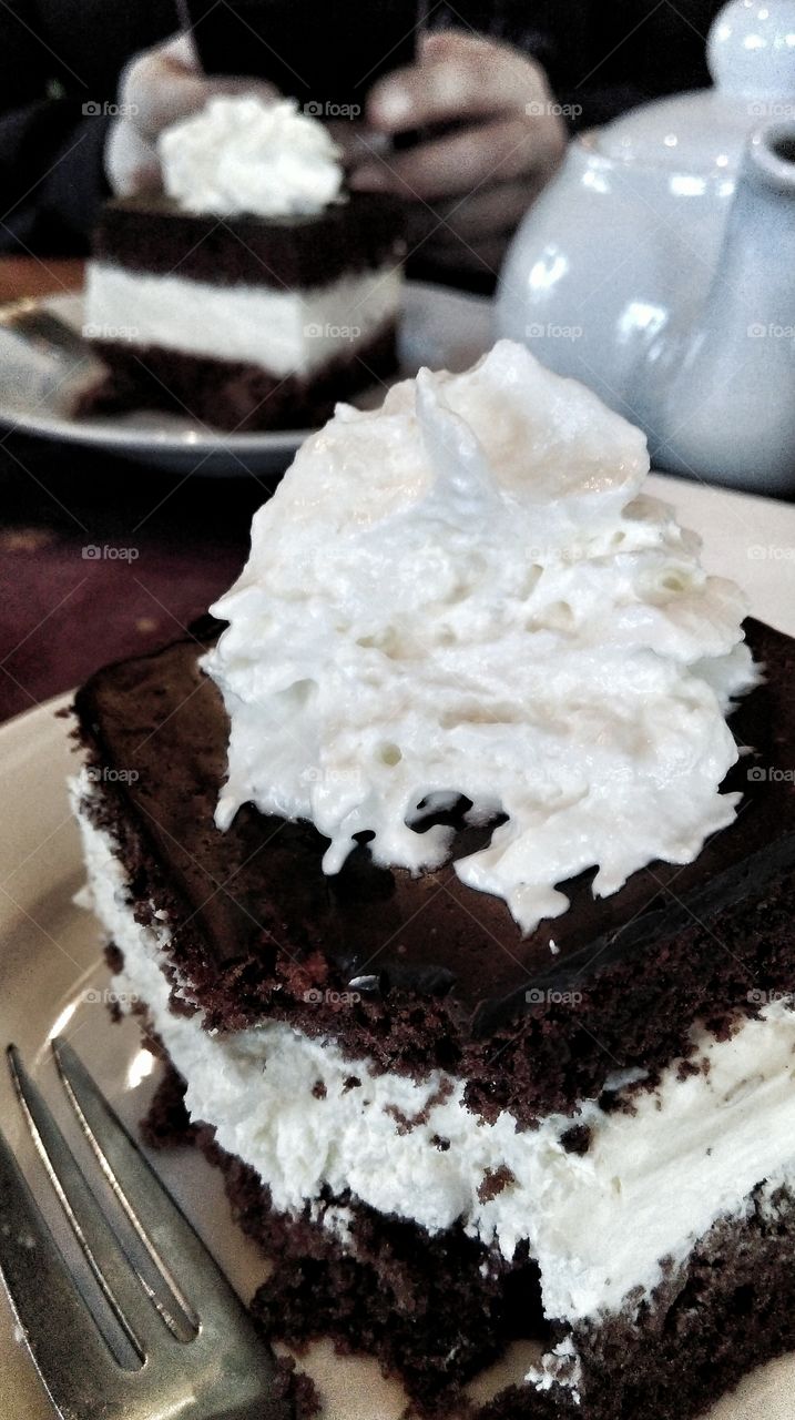 Chocolate cake with whipped cream