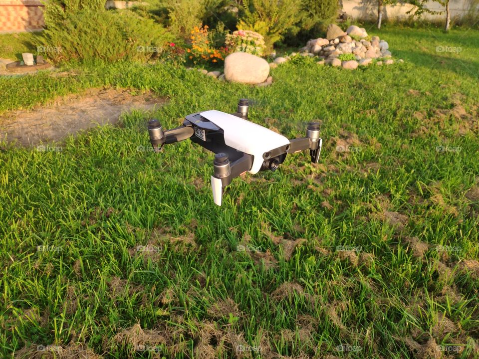 Drone on the background of beautiful flower beds