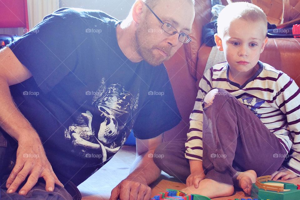 Father and son playing