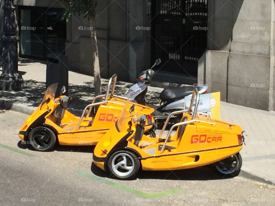 Small funny cars parked on the street