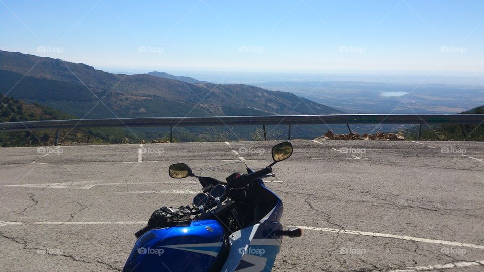 Blue motorbike in the mountains