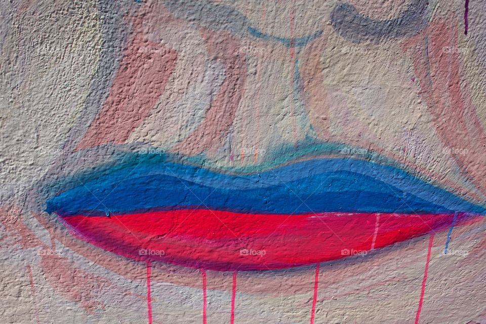 A closeup portion of a mural showing abstract lips.