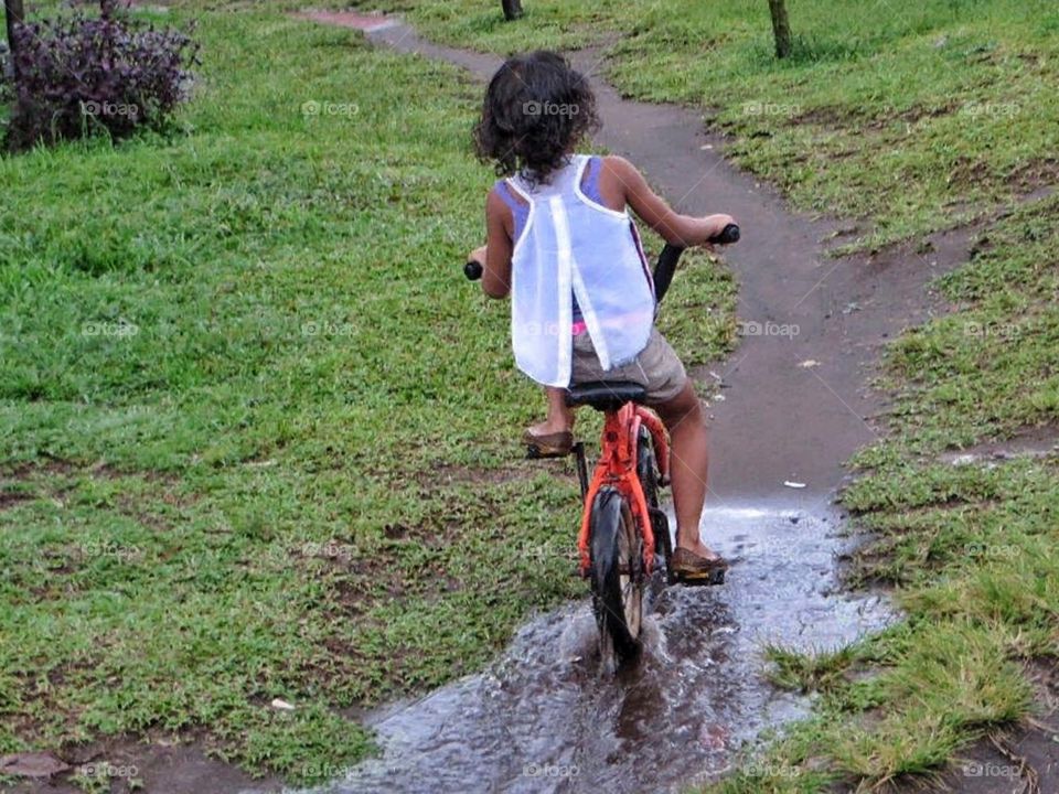 Little girl on her bike 