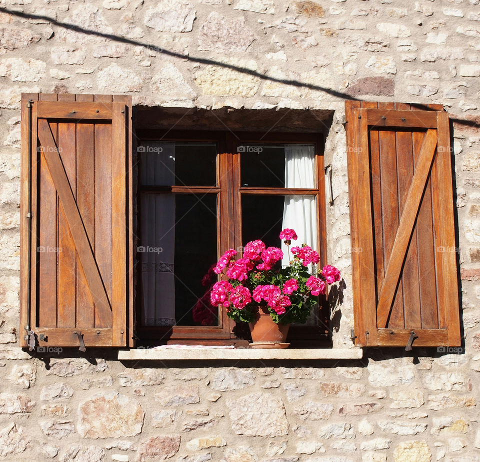 View of open window with flowers