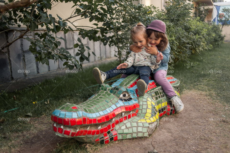 Little sisters in park