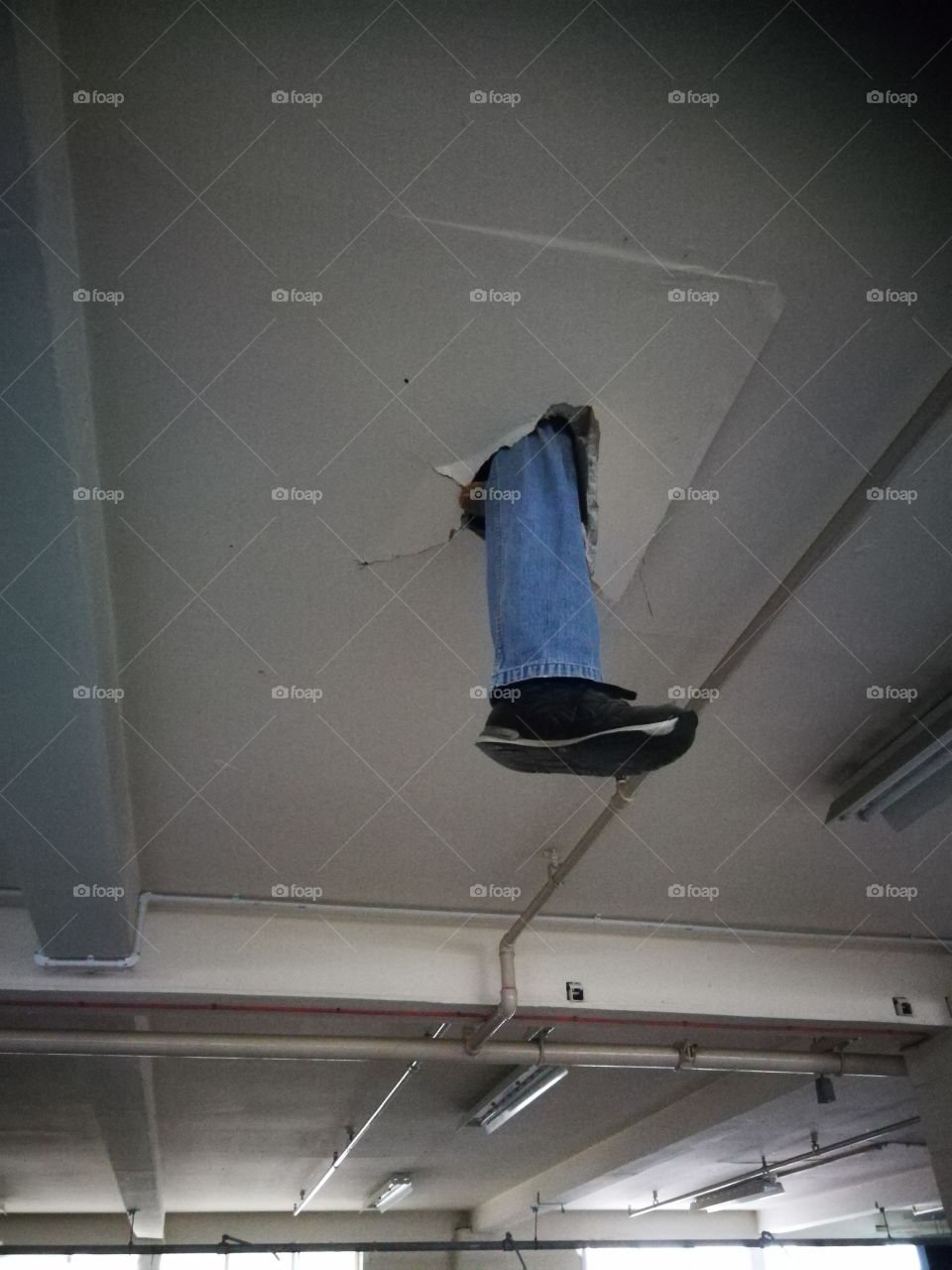Leg in the ceiling