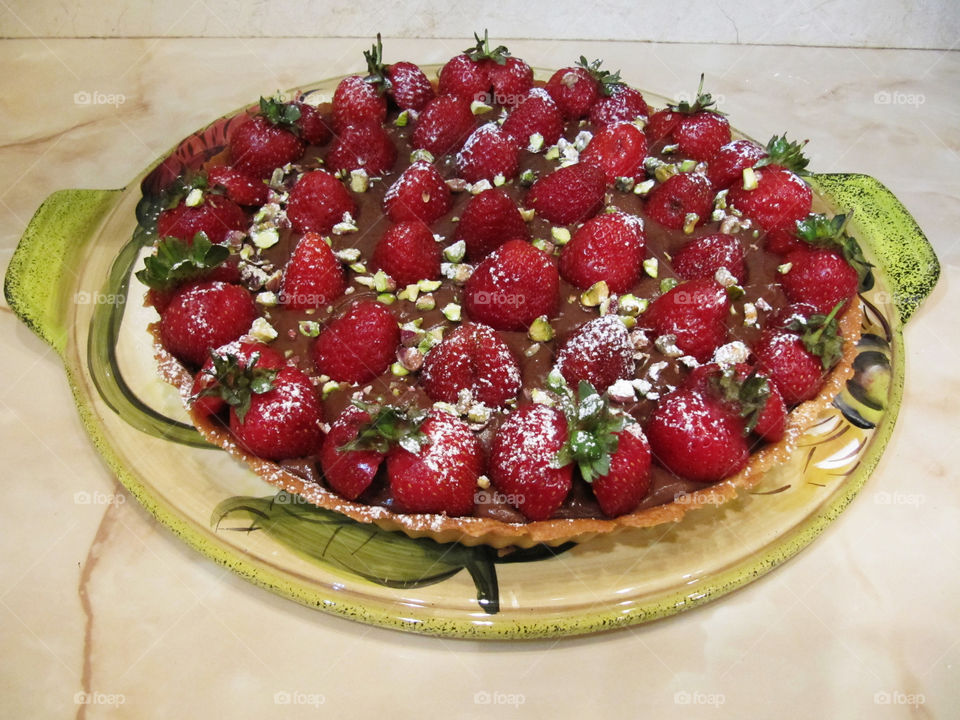 Strawberry tart with chocolate cream and crunch pistachios