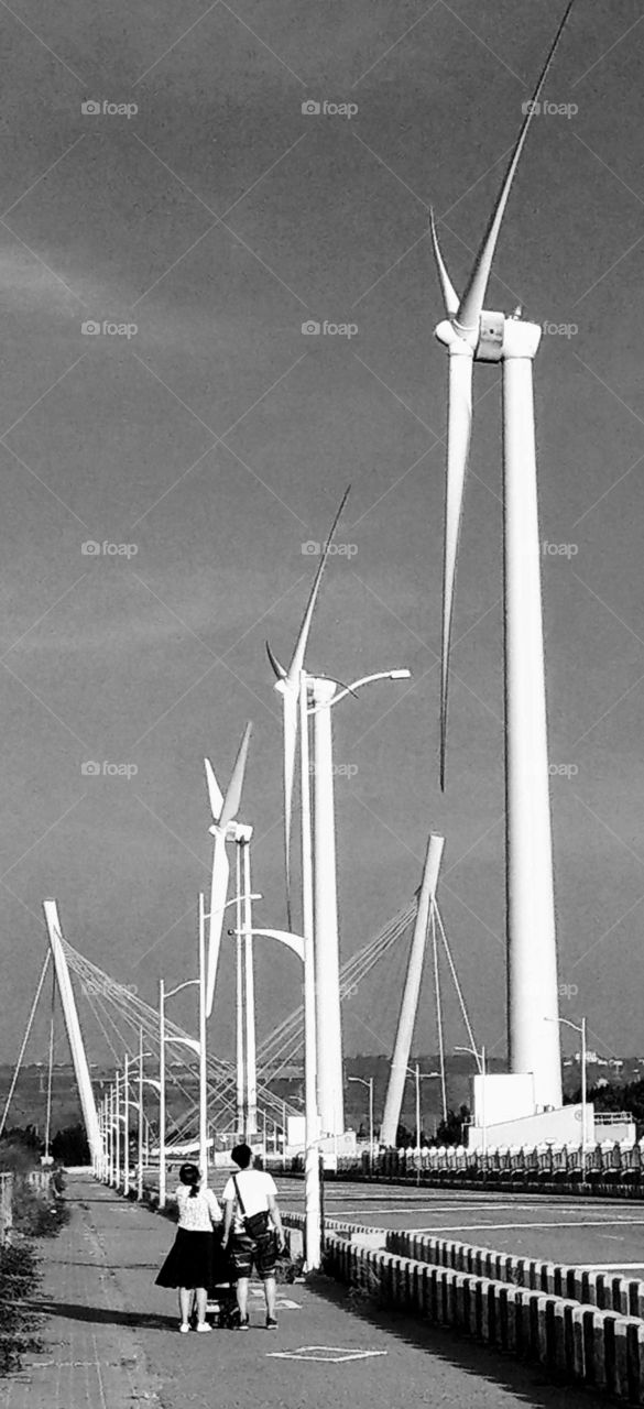 World in black and white: visit wind electric power windmills at local seaside and take a trip. spectacular view.