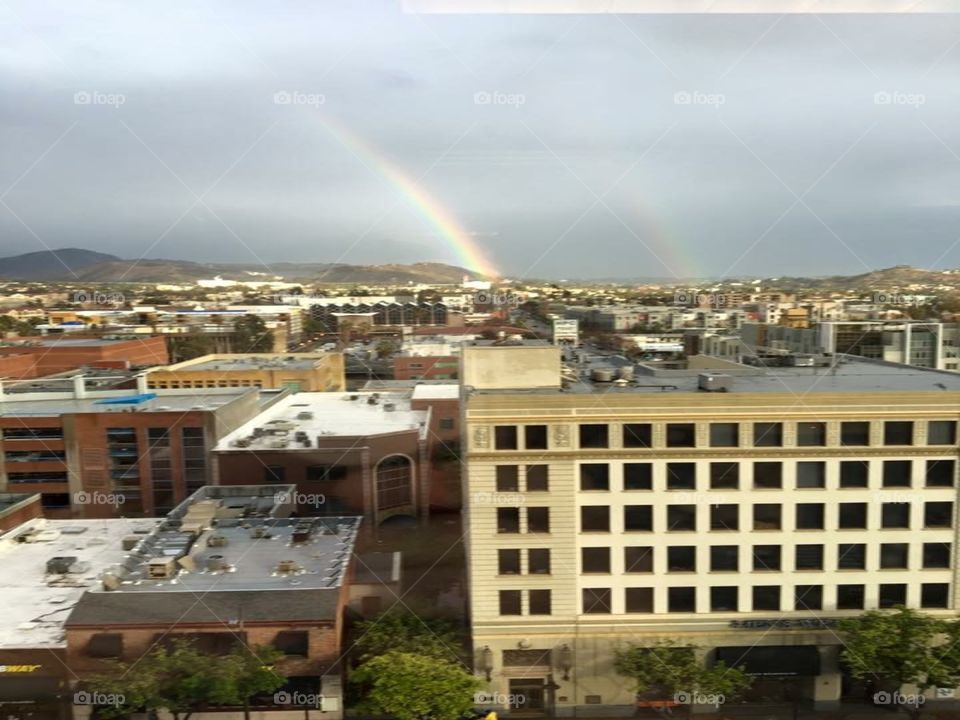 Double rainbow over the city