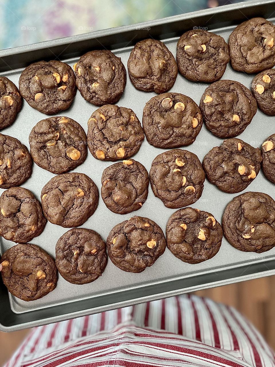 Woman holding tray of cookies, cookies on a baking sheet, making cocoa caramel cookies, delicious and decadent cookies, cookies made with love