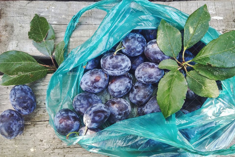 plums in a bag, fruits, autumn harvests, vitamins, healthy food, plum fruits