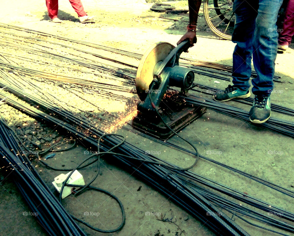 real and natural photo of ironwork,Photos of iron cutting machine,photos of cutting machine,photos of iron cutting work,photos in progress,photos of iron cutting work,a great picture of true hard work,photos of iron work,