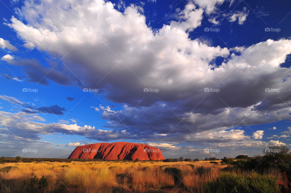 Uluru the biggest monolith rock in the world during the sunst