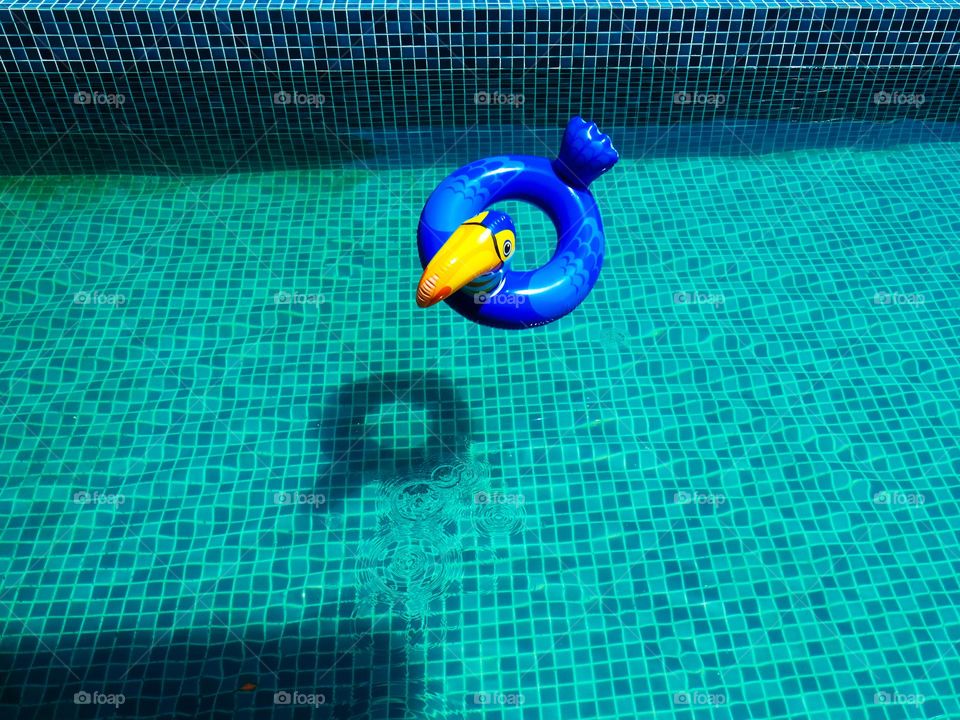 A toy floater thrown into a pool