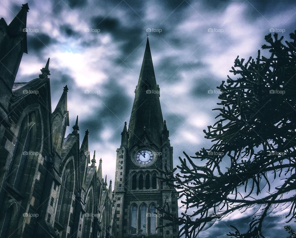 Five to twelve on church spire clock