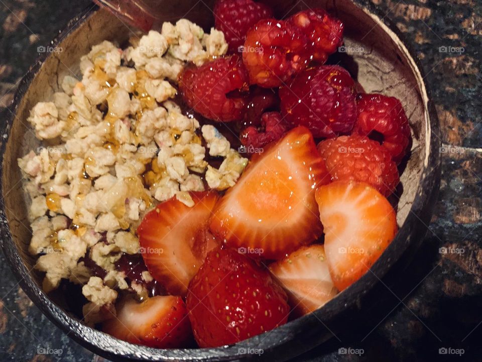 Açai berry fruit bowl with strawberries and granola